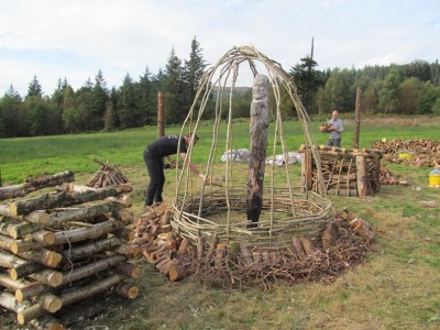 Figure 4. Pyres being constructed in advance of our second Arran ‘Build ‘N’ Burn’ event, in September 2014; this took place within the charred remnants of the original timber circle (photograph: Kenneth Brophy).